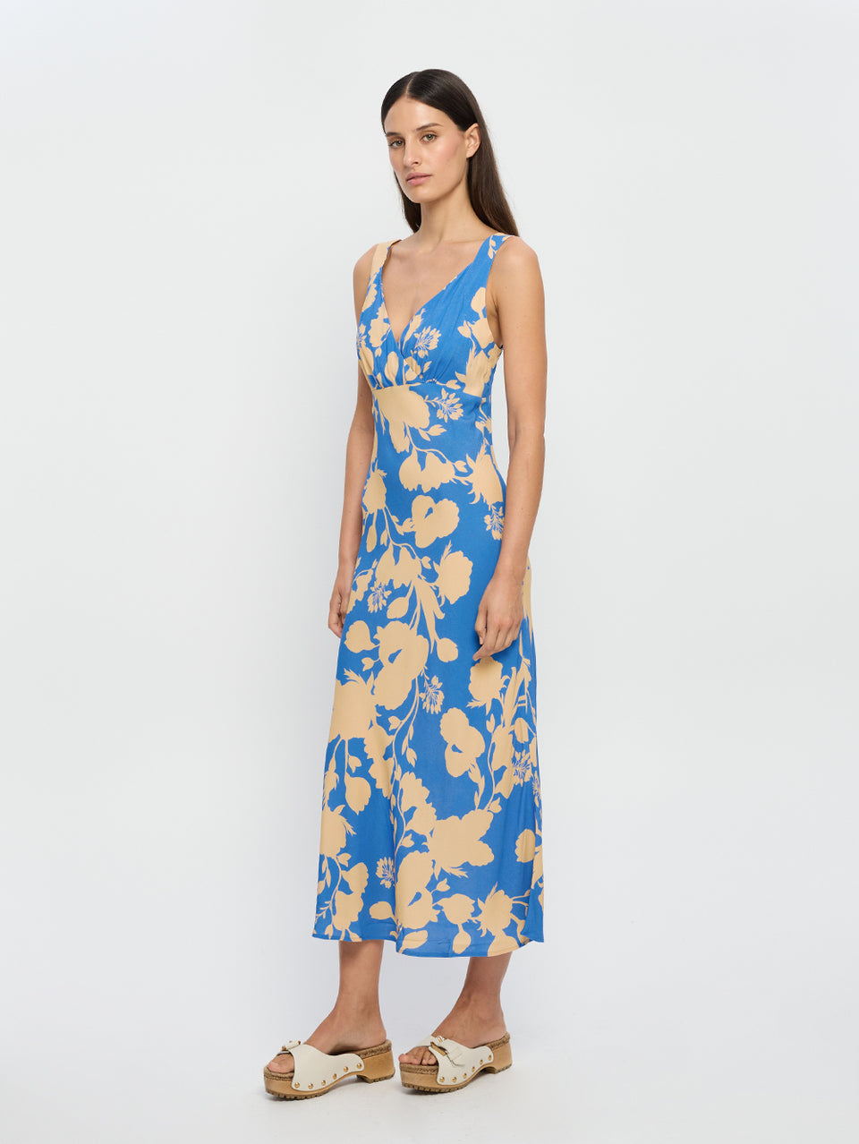 Aurora Midi Dress KIVARI | Model wears blue floral midi dress side view