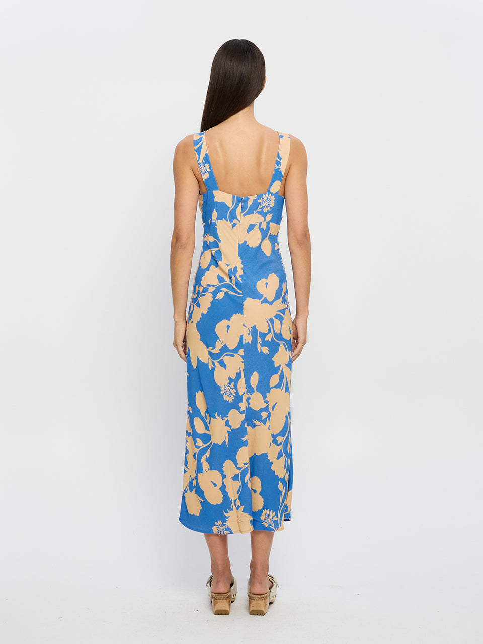 Aurora Midi Dress KIVARI | Model wears blue floral midi dress back view