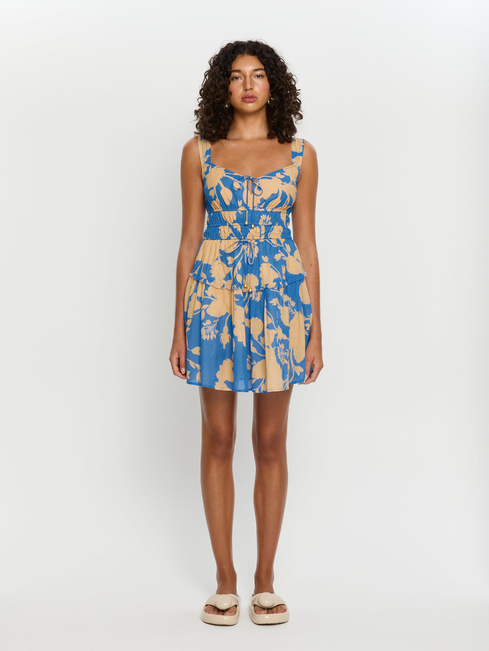 Aurora Mini Gathered Dress KIVARI | Model wears blue floral mini dress