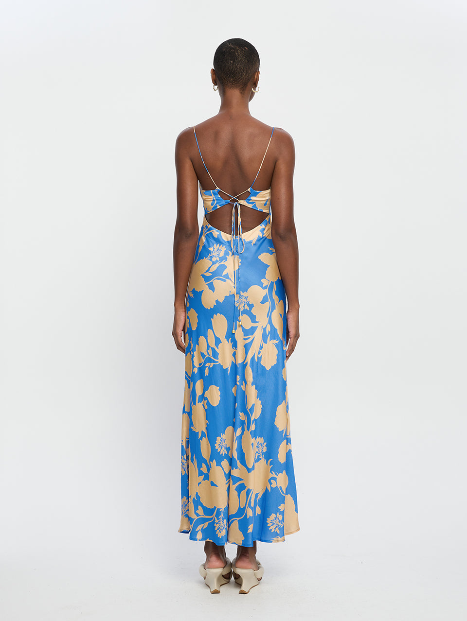 Aurora Strappy Maxi Dress KIVARI Model wears blue floral maxi dress back view