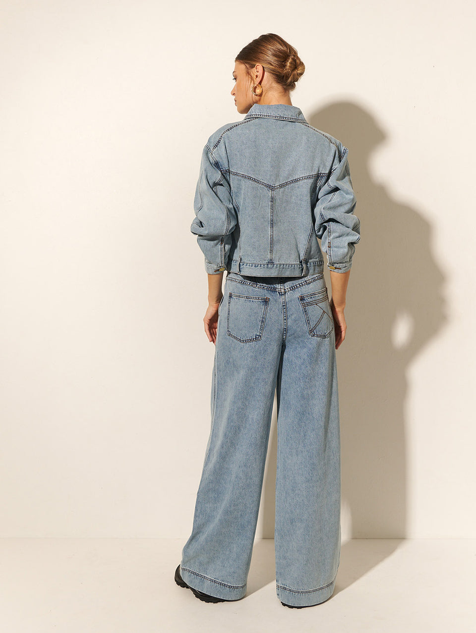 KIVARI Azalia Denim Jacket | Model wearing Blue Denim Jacket Back View