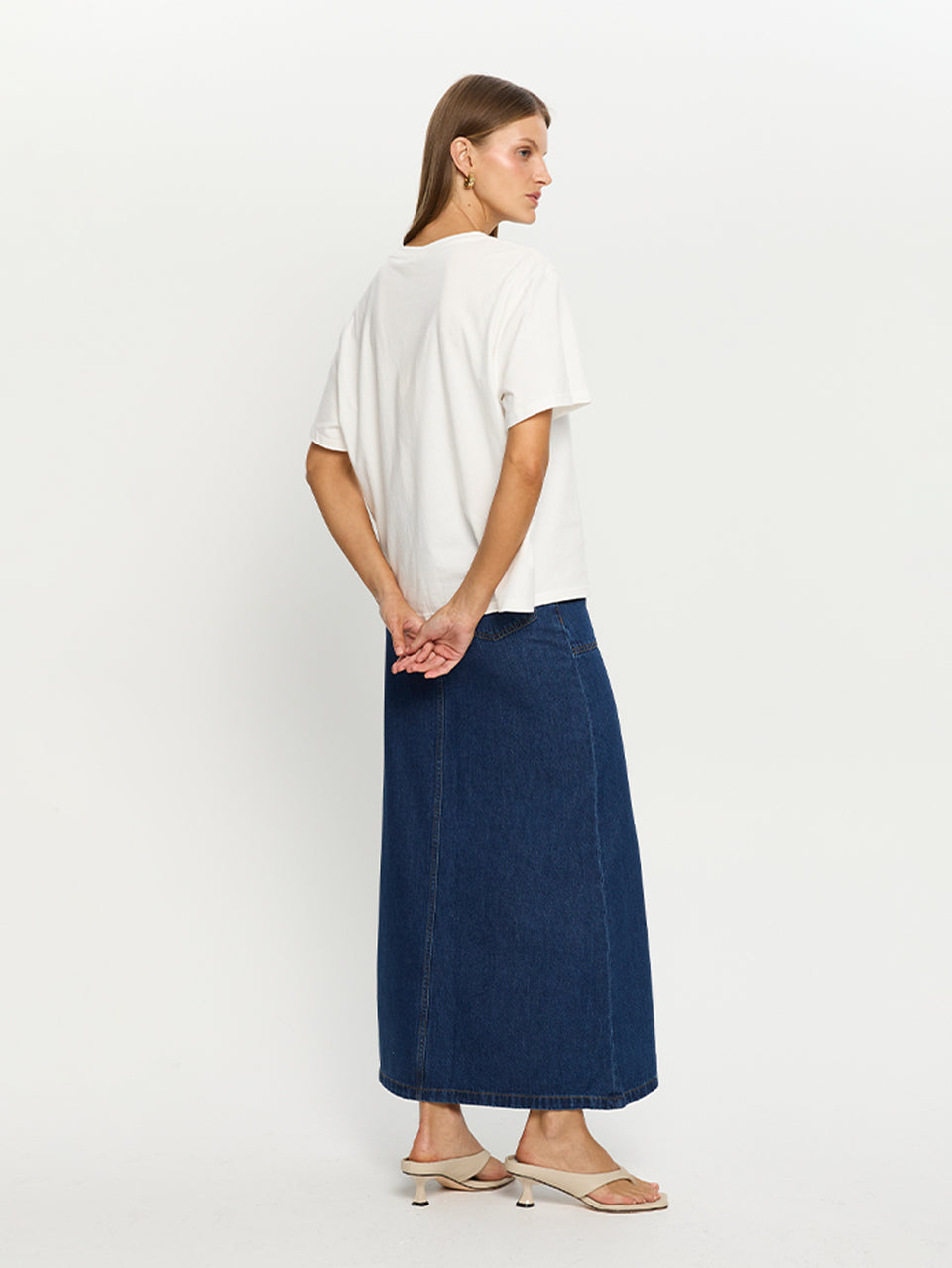 Dani Skirt KIVARI | Model wears denim skirt back view