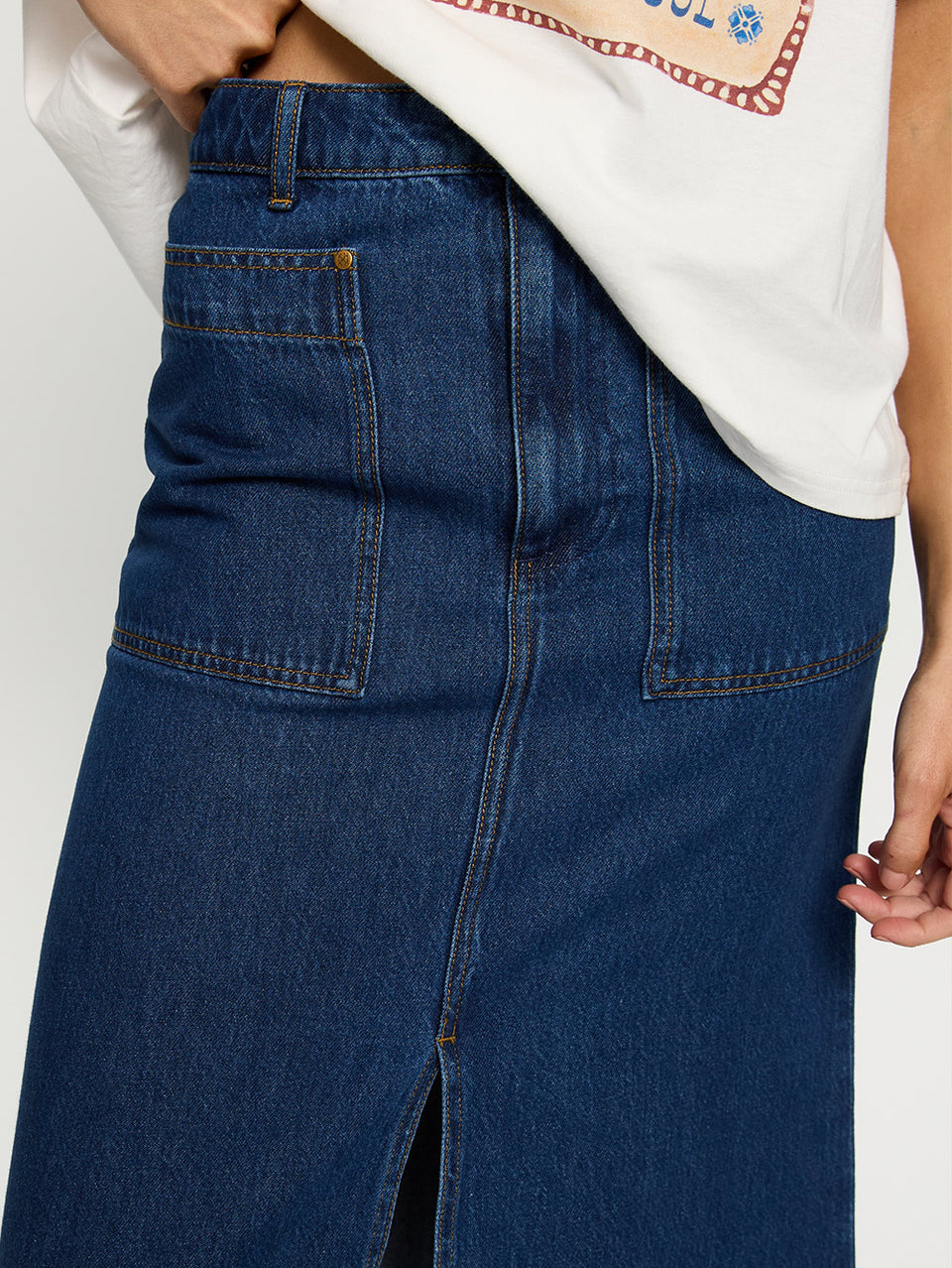 Dani Skirt KIVARI | Model wears denim skirt close up