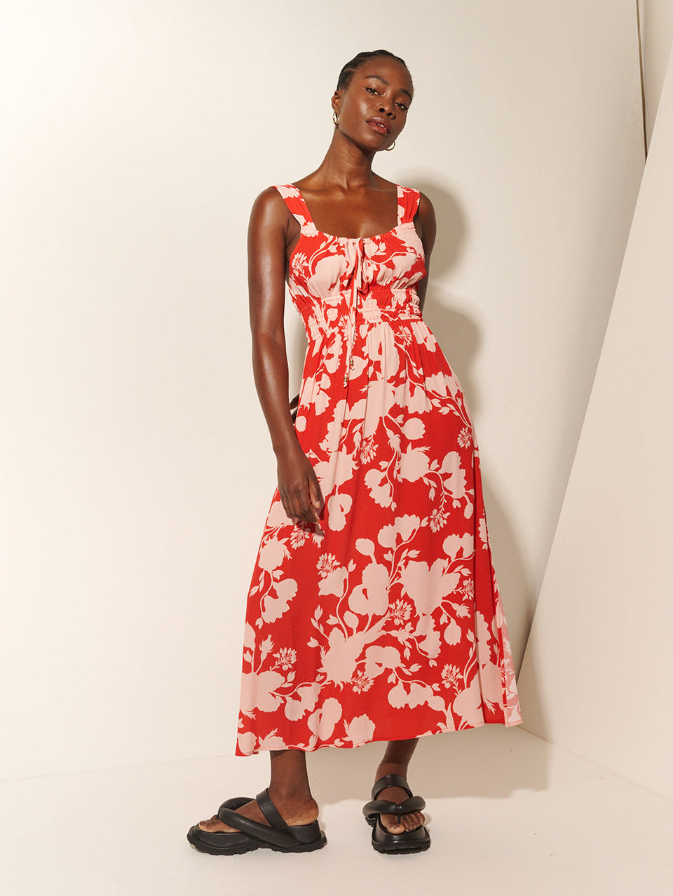 Delfina Midi Dress KIVARI | Model wears red and pink floral midi dress