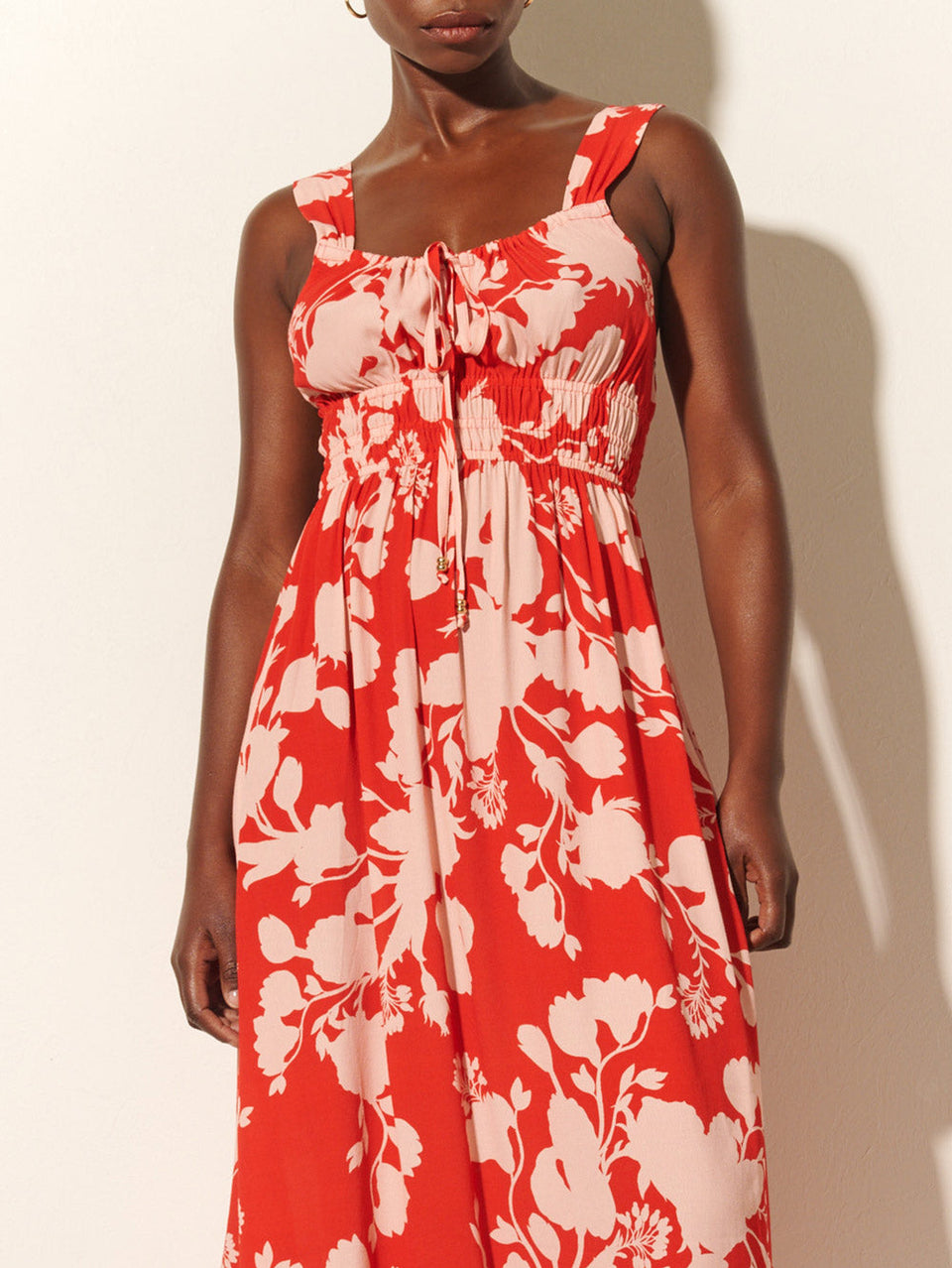 Delfina Midi Dress KIVARI | Model wears red and pink floral midi dress close up