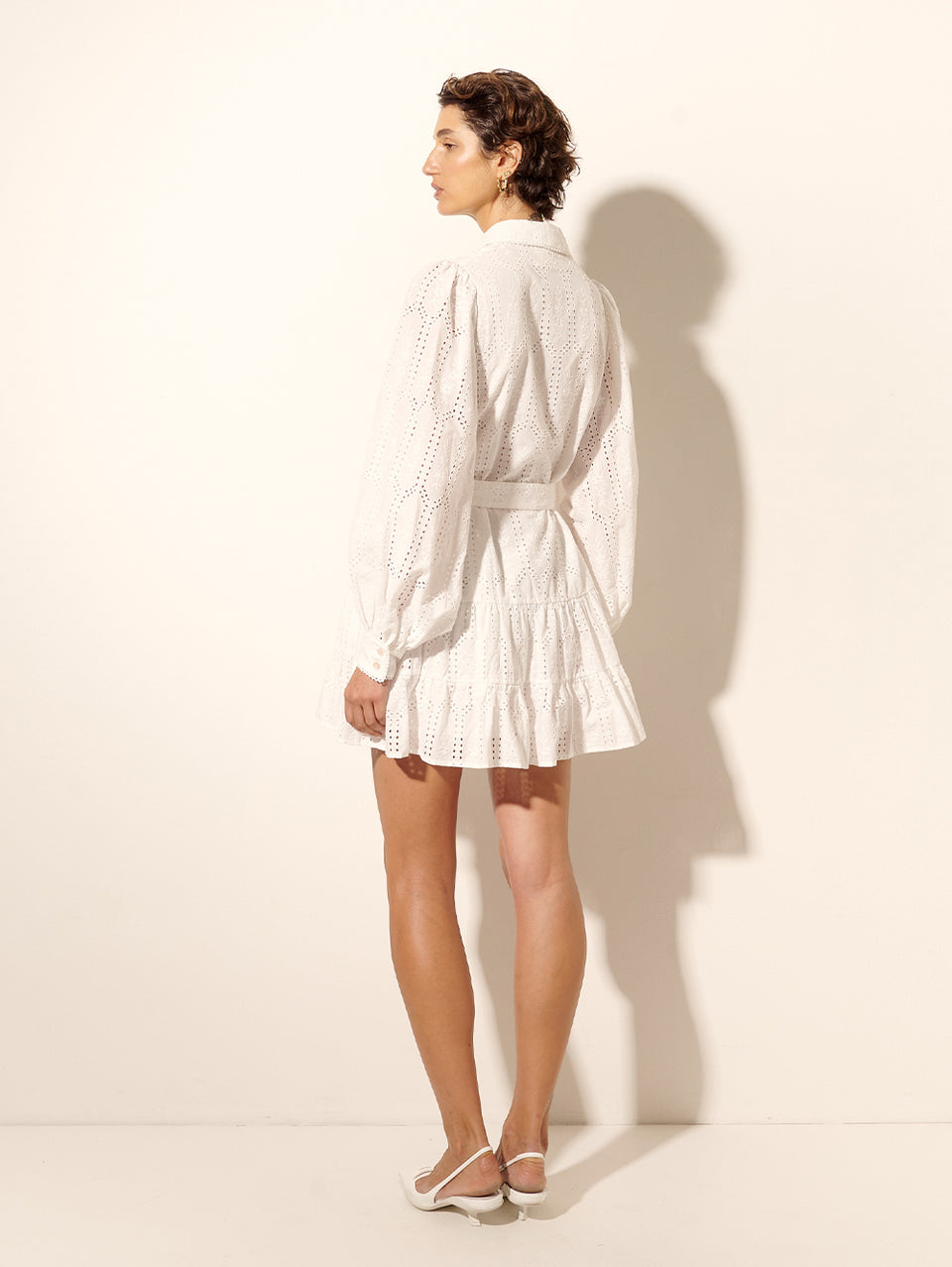 Haven Mini Dress KIVARI | Model wears white mini shirt dress back view