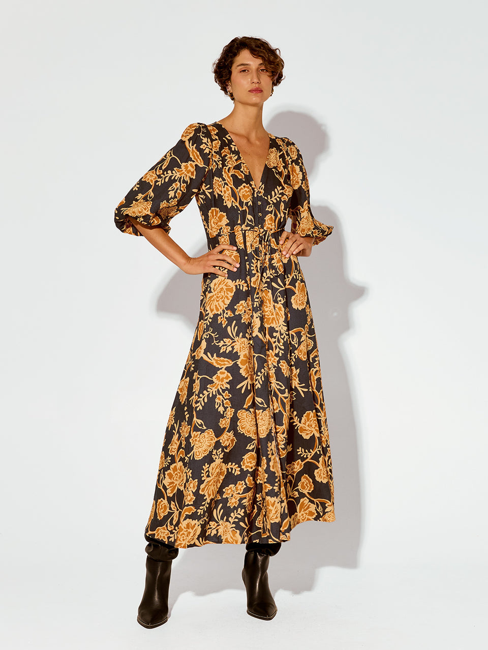 Kaia Maxi Dress KIVARI | Model wears orange and black floral maxi dress