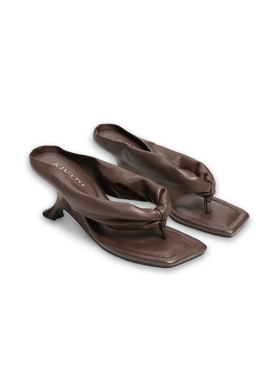 Pair of brown high-heeled sandals on a white background