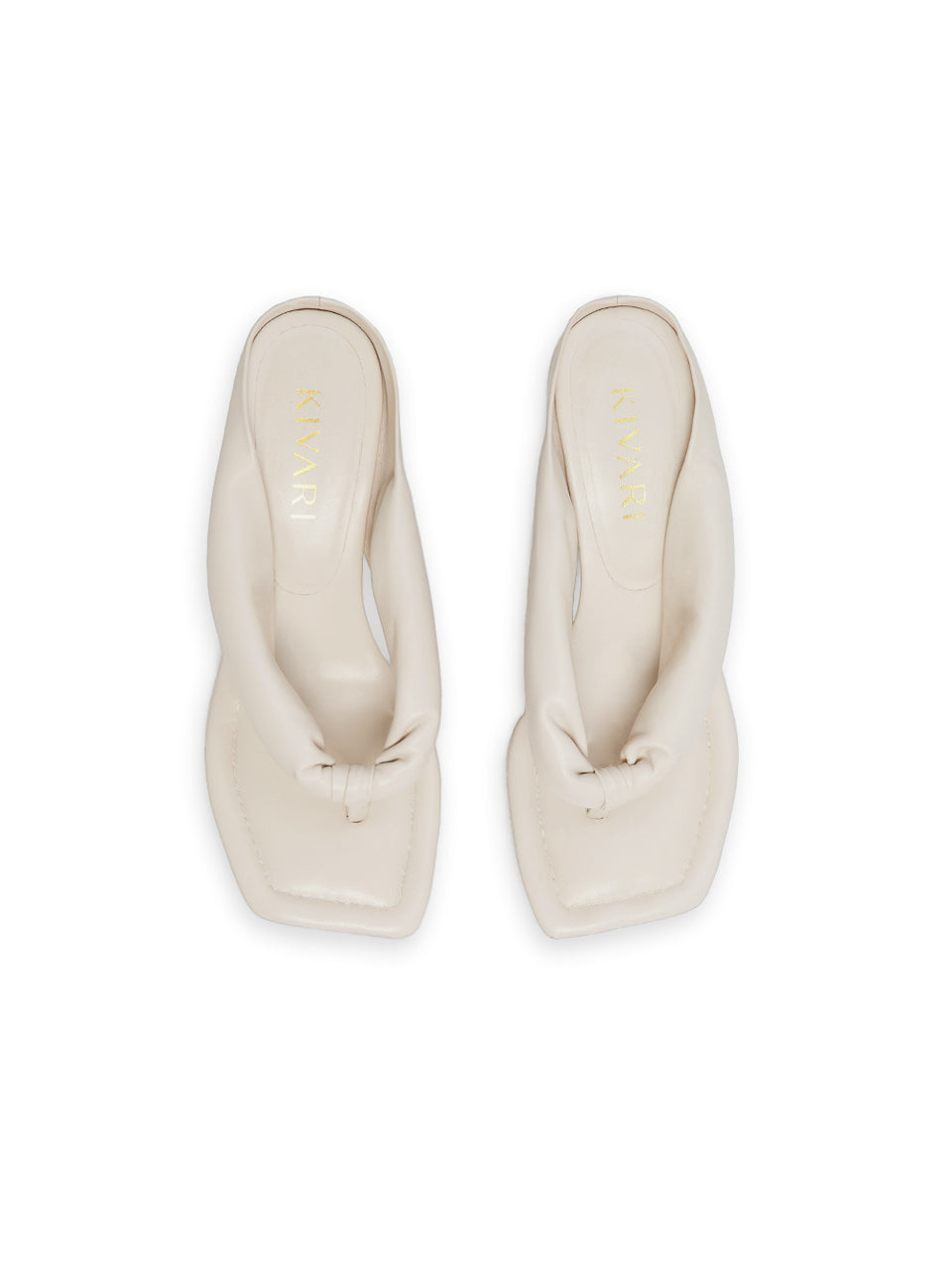 Pair of white heels on a white background