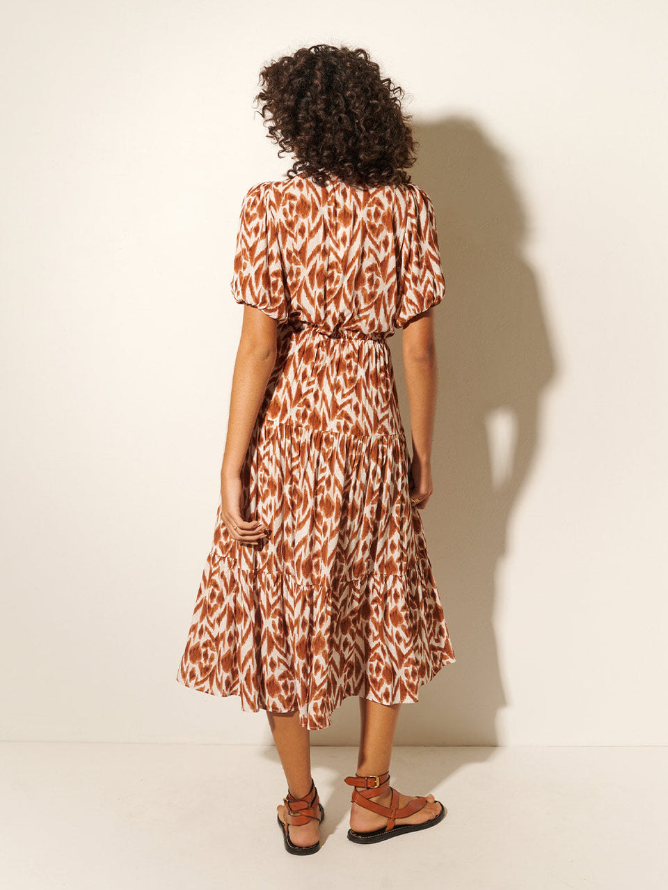 Marisa Tie Front Midi Dress KIVARI | Model wears brown and ivory aztek printed midi dress back view