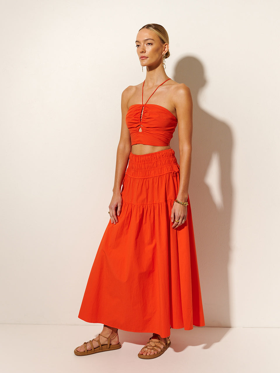 Nora Maxi Skirt | Model wears red maxi skirt side view
