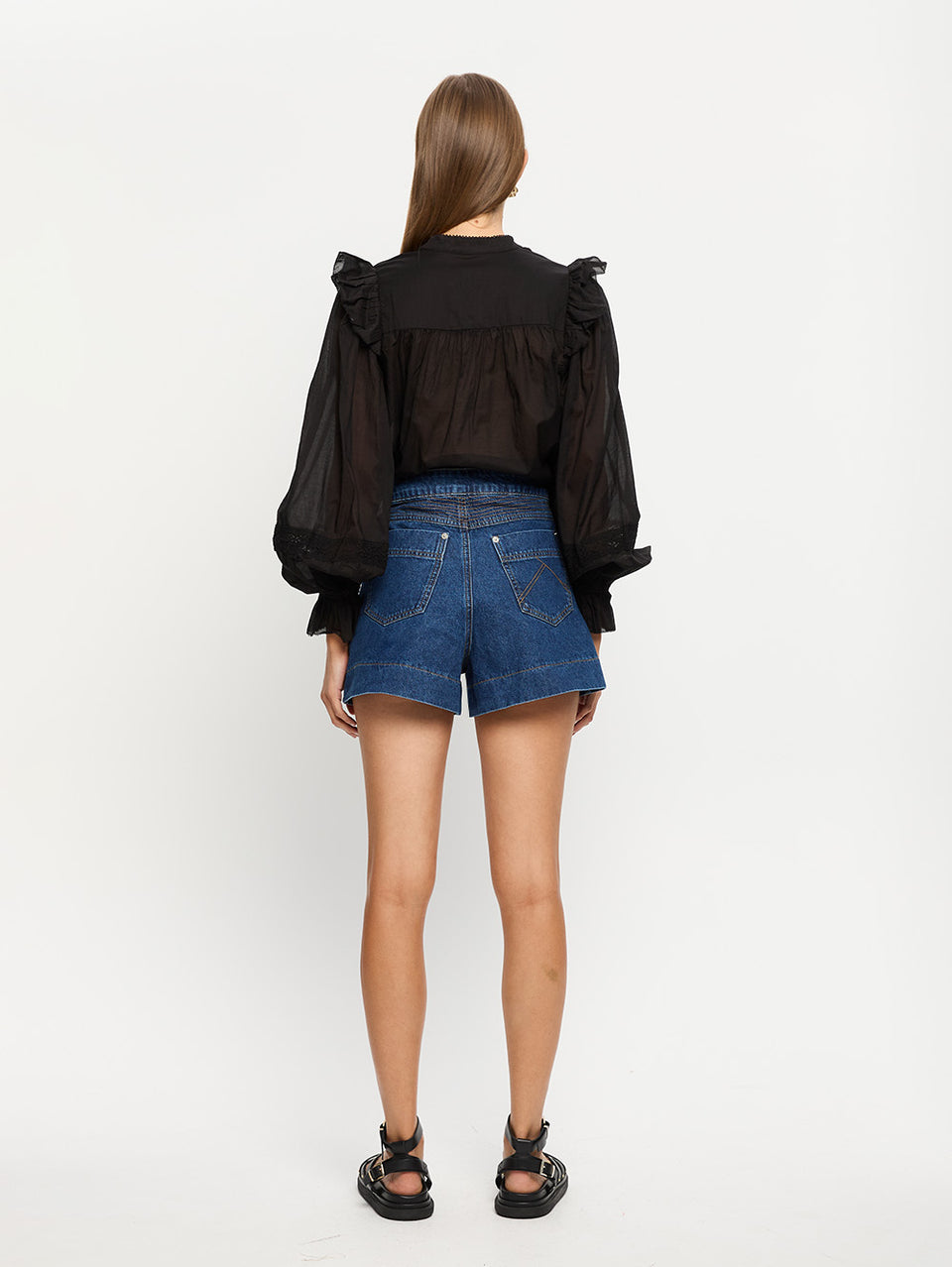 Celene Denim Short Indigo | Model wears blue denim short with Black top