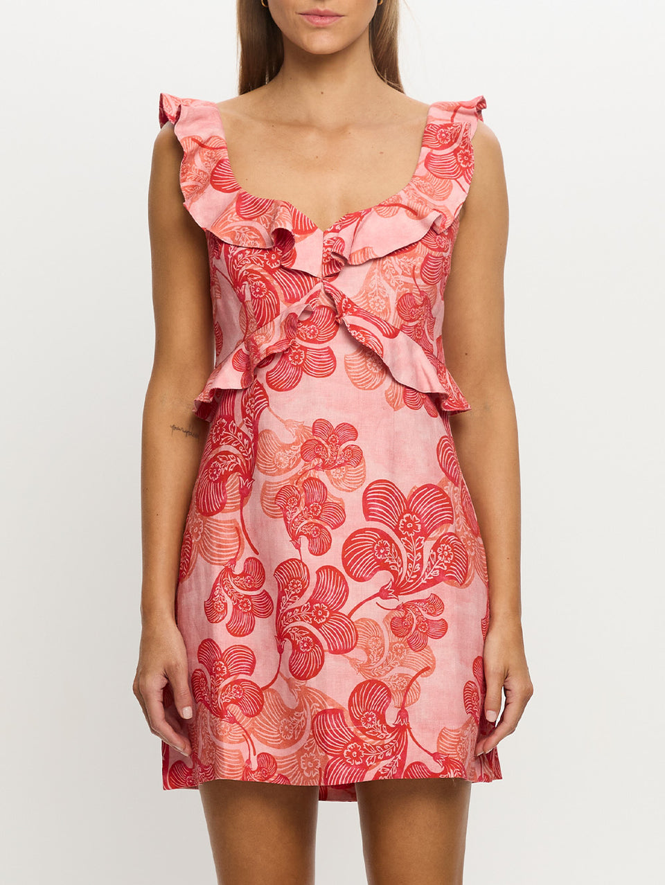 Woman in pink and red floral dress