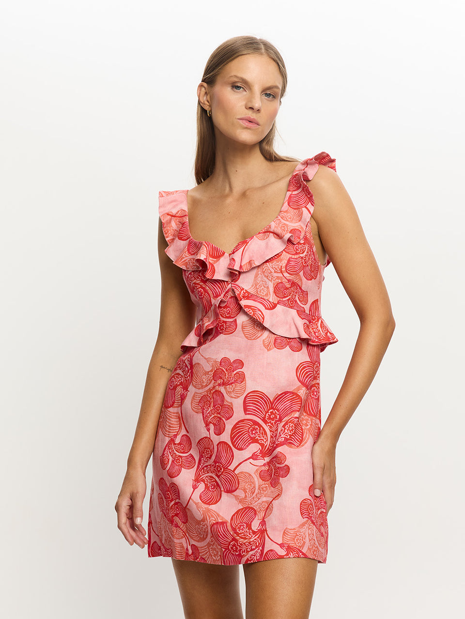 Woman in pink and red floral dress