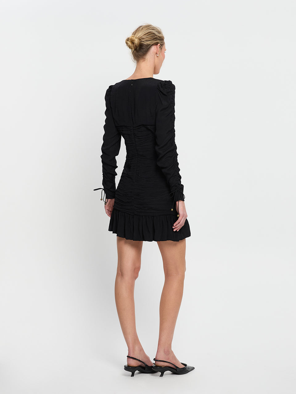 Scarlett Gathered Mini Dress Black KIVARI | Model wears black mini dress back view