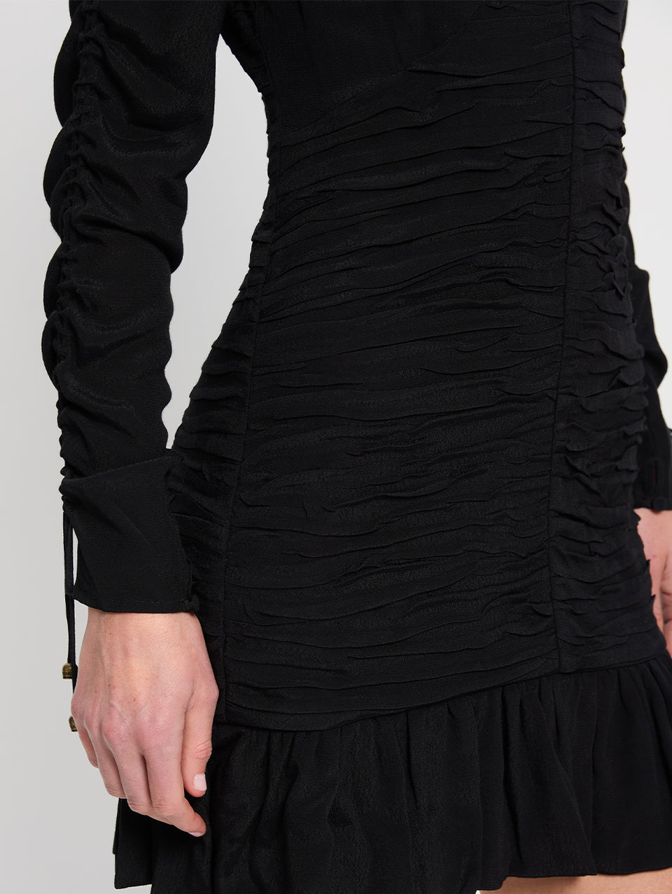 Scarlett Gathered Mini Dress Black KIVARI | Model wears black mini dress close up