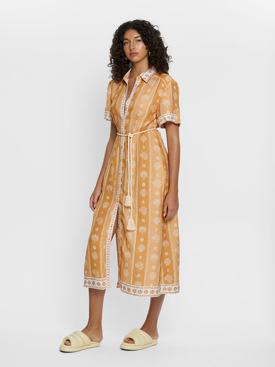 Sienna Midi Dress KIVARI | Model wears orange print midi dress side view