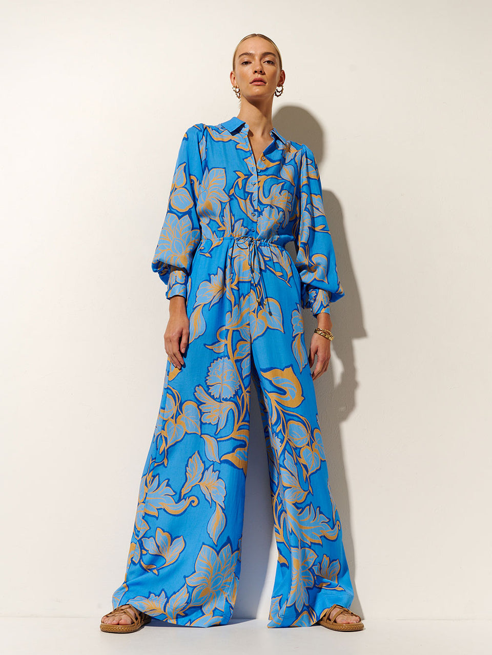 Taniana Jumpsuit KIVARI | Model wears blue and orange floral jumpsuit