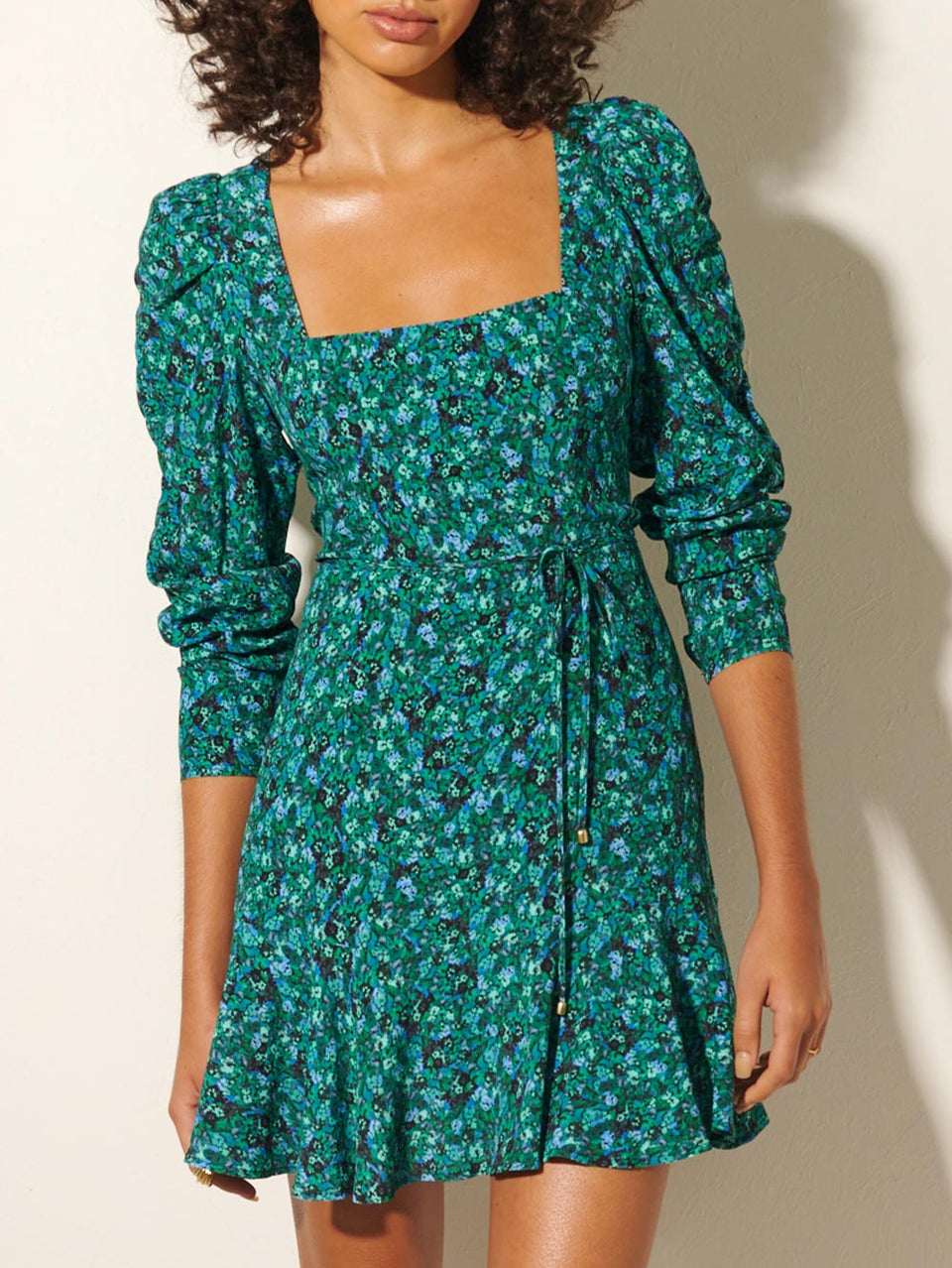 KIVARI Acacia Mini Dress | Model wears Green Floral Mini Dress Close Up