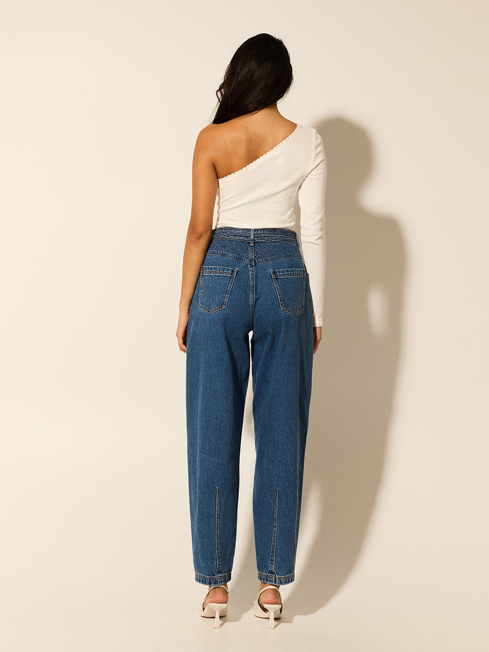 Adina Jean KIVARI | Model wears blue denim jean back view