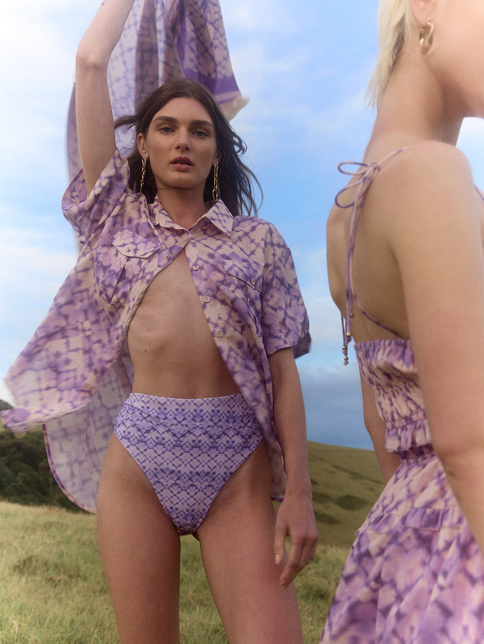 Alice High Waist Bikini Bottom KIVARI | Model wears purple tie dye printed high waisted bikini bottoms campaign
