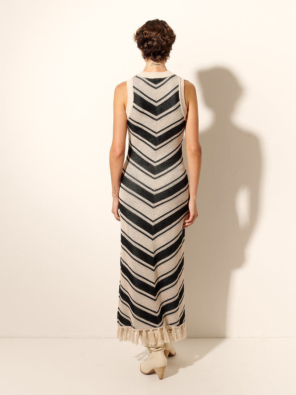 Anita Knit Midi Dress KIVARI | Model wears black and white chevron knit dress back view