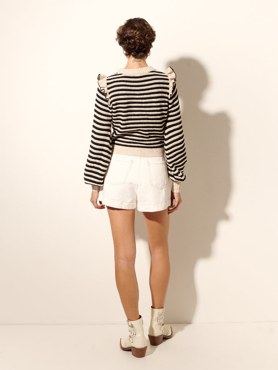 Anita Knit Top KIVARI | Model wears black and white striped knit jumper back views