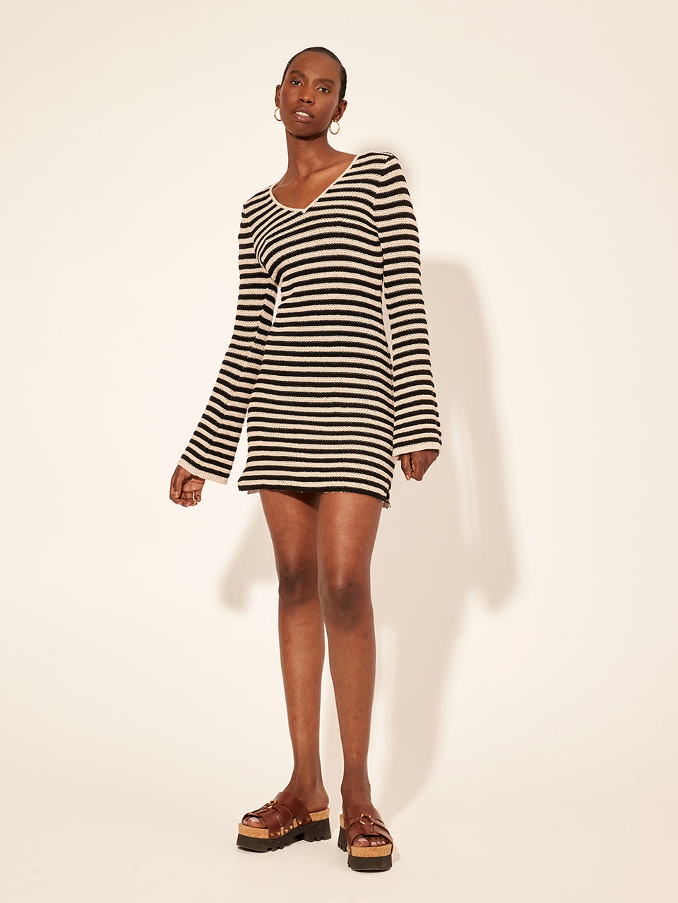 Anita Knit Mini Dress KIVARI | Model wears black and white stripe knit mini dress