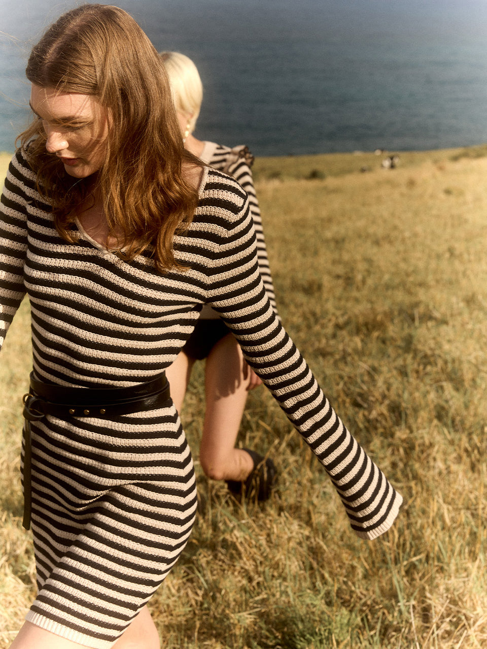 Anita Knit Mini Dress KIVARI | Model wears black and white stripe knit mini dress campaign