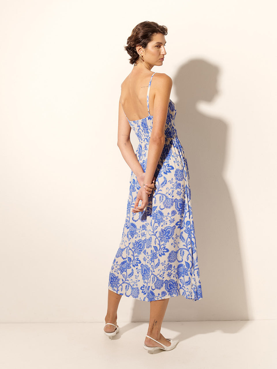 Athena Midi Dress KIVARI | Model wears blue and white paisley midi dress back view