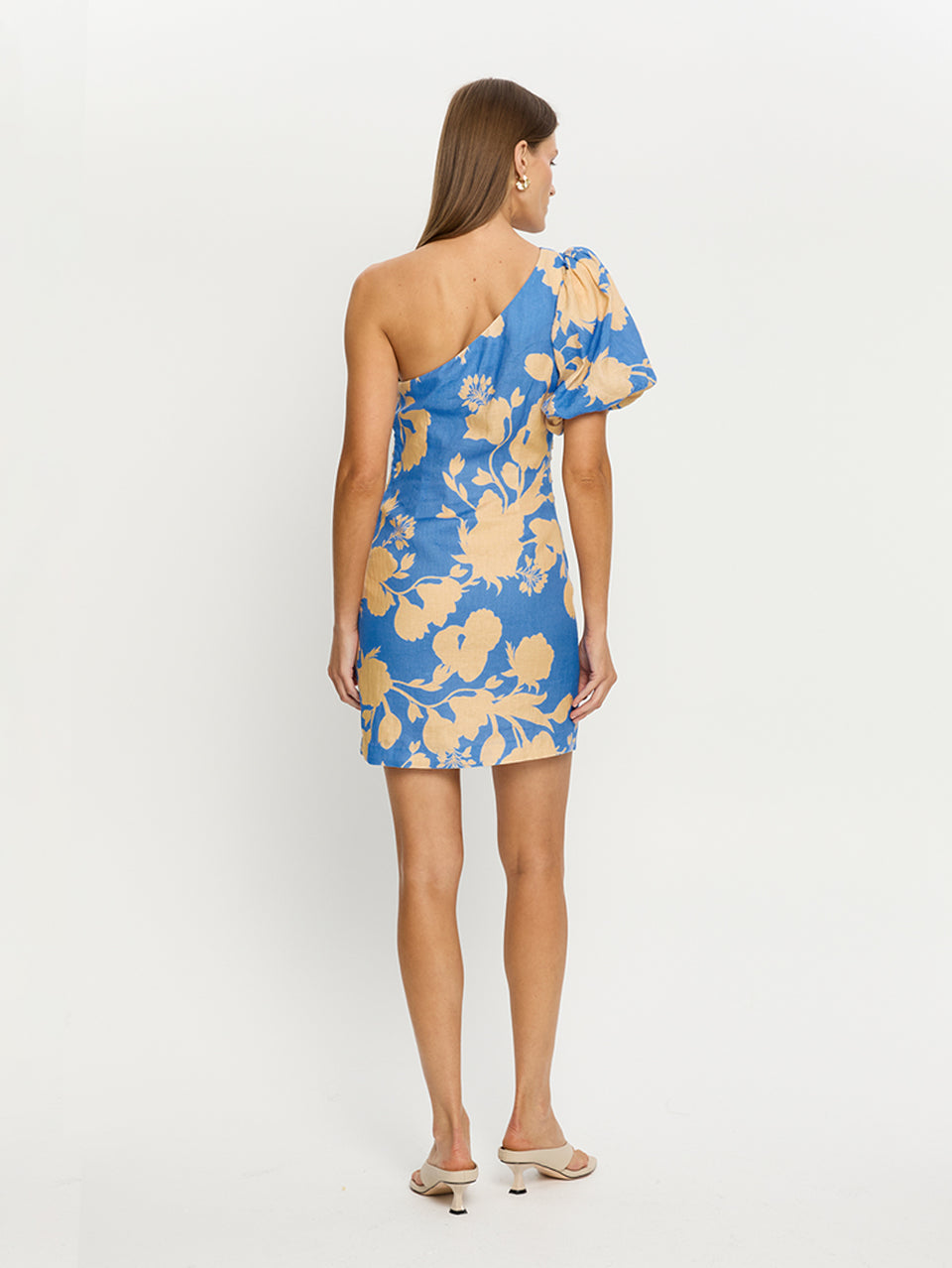 Aurora Mini Dress KIVARI | Model wears blue floral mini dress back view