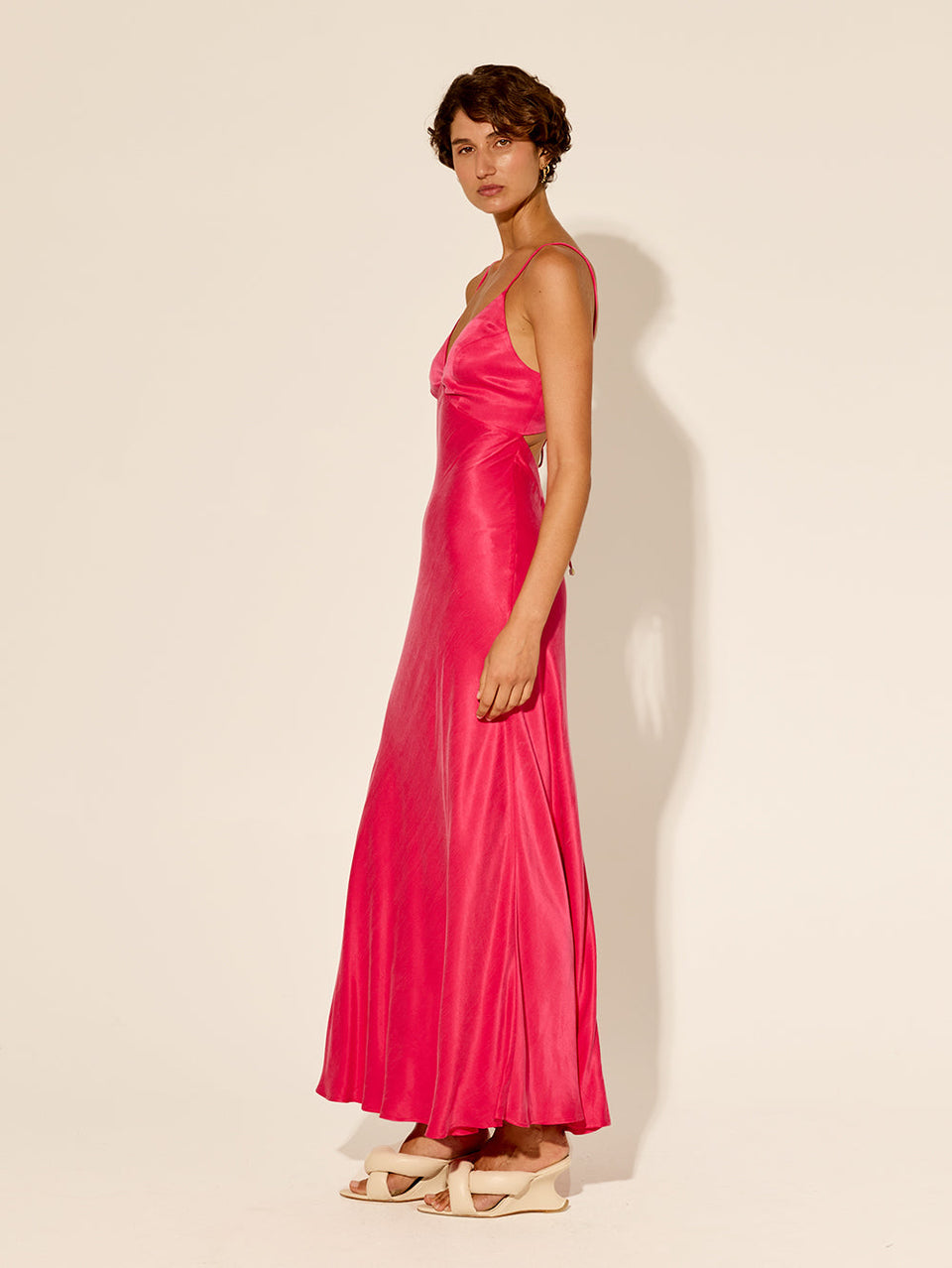 Bianca Slip Dress Pink KIVARI | Model wears hot pink slip dress side view