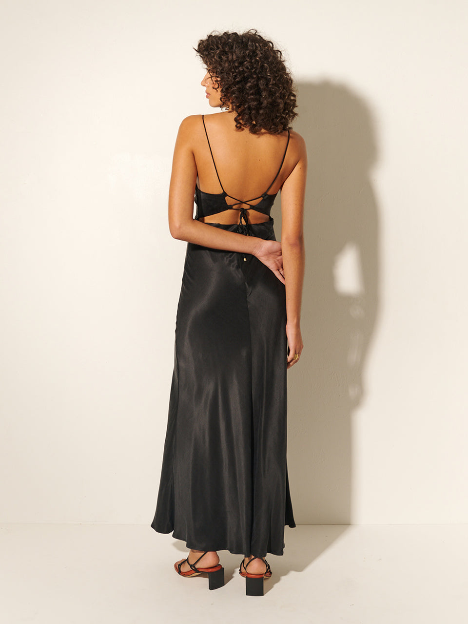 KIVARI Bianca Slip Maxi Dress | Model wears Black Slip Maxi Dress Back View