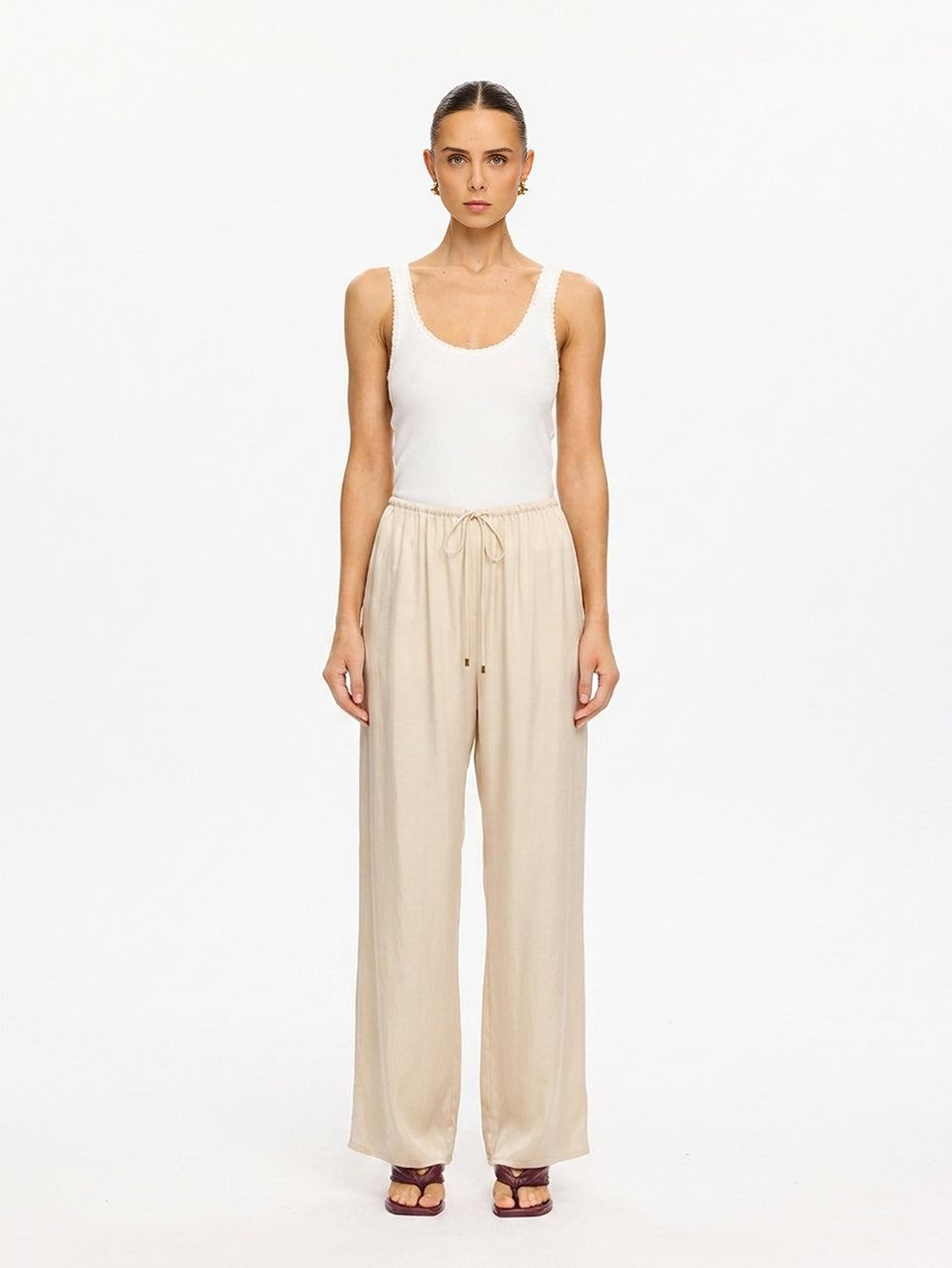 KIVARI Blythe Pant in Champagne – front-facing product photo with white tank top