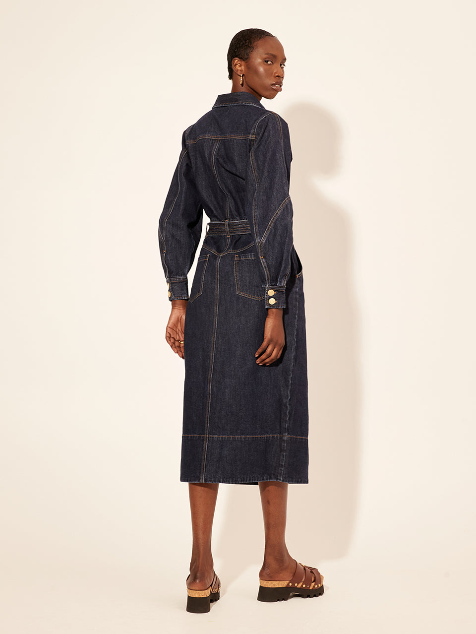 Bonny Midi Dress KIVARI | Model wears navy denim midi dress back view