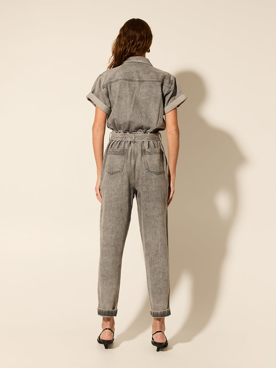 Brae Boilersuit Grey KIVARI | Model wears grey denim boilersuit back view
