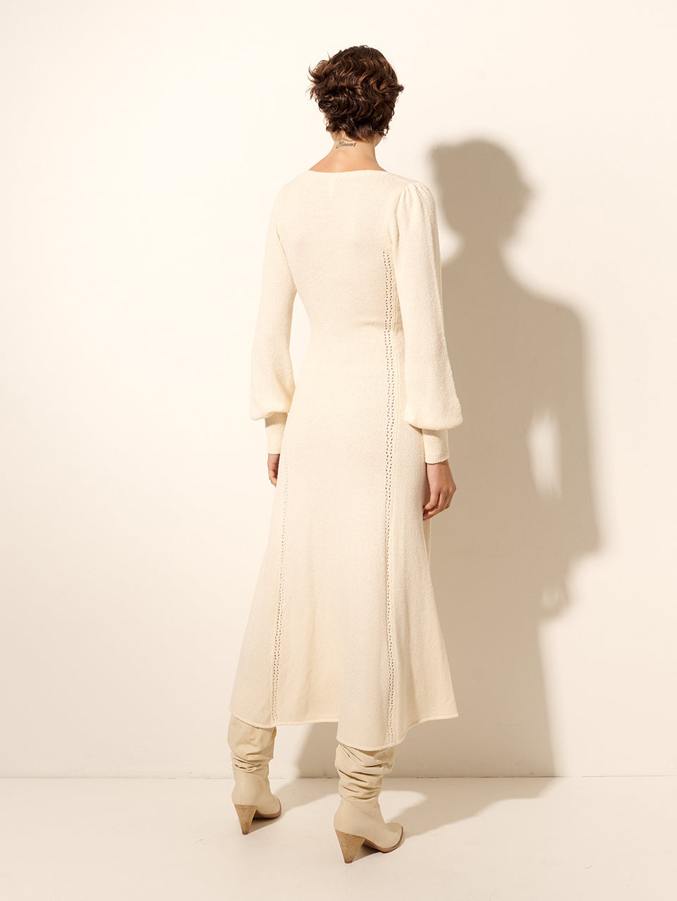 Cali Knit Dress KIVARI | Model wears cream knit midi dress back view