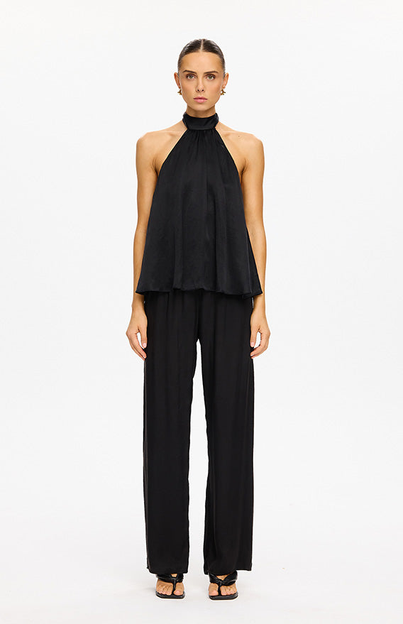 KIVARI categories image - model wearing black halterneck top with black wide-leg trousers elegant minimalist outfit