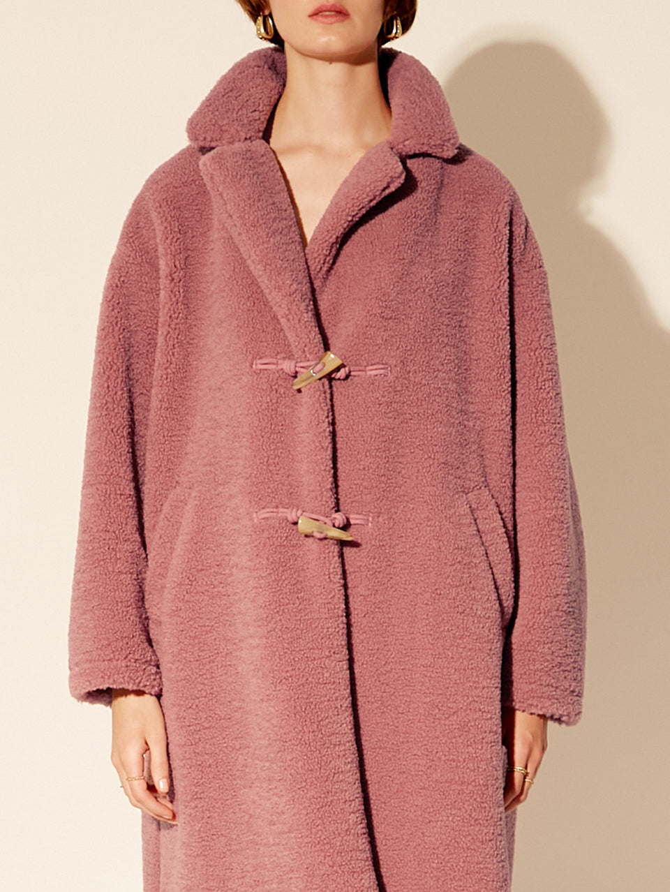 Clara Coat KIVARI | Model wears pink fluffy coat close up