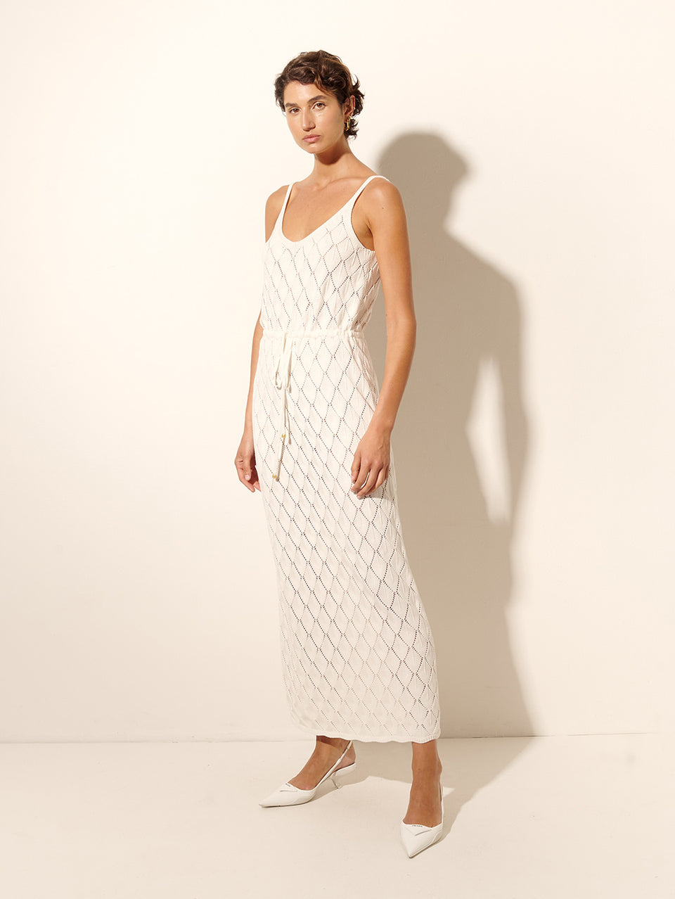 Claudia Strappy Knit Dress KIVARI | Model wears cream knit midi dress side view