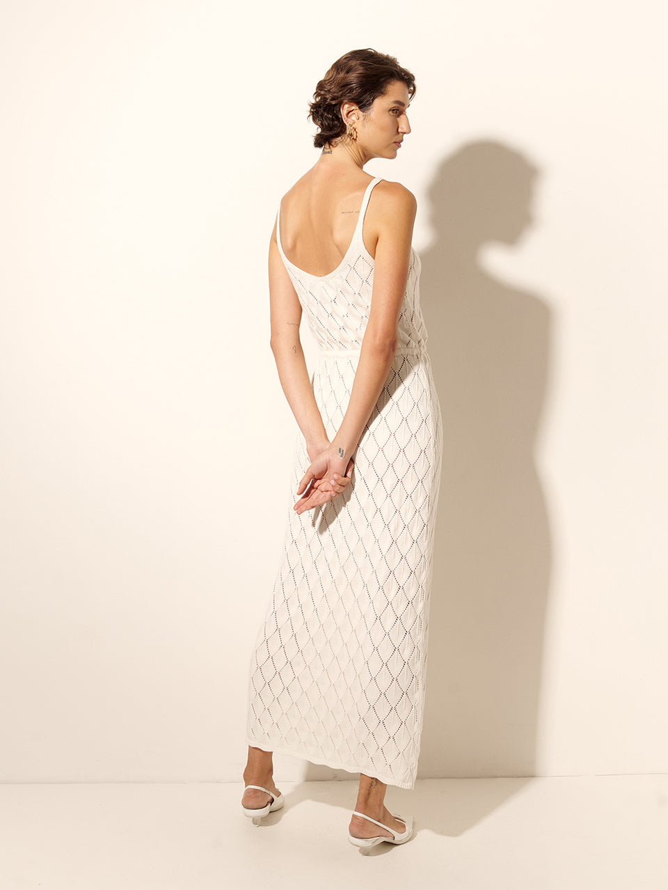 Claudia Strappy Knit Dress KIVARI | Model wears cream knit midi dress back view