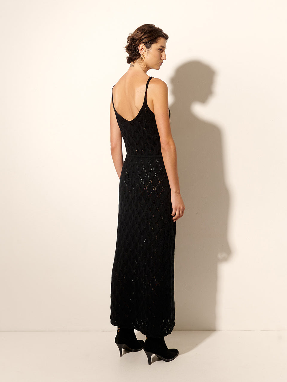 Claudia Strappy Midi Dress Black KIVARI | Model wears black knit midi dress back view