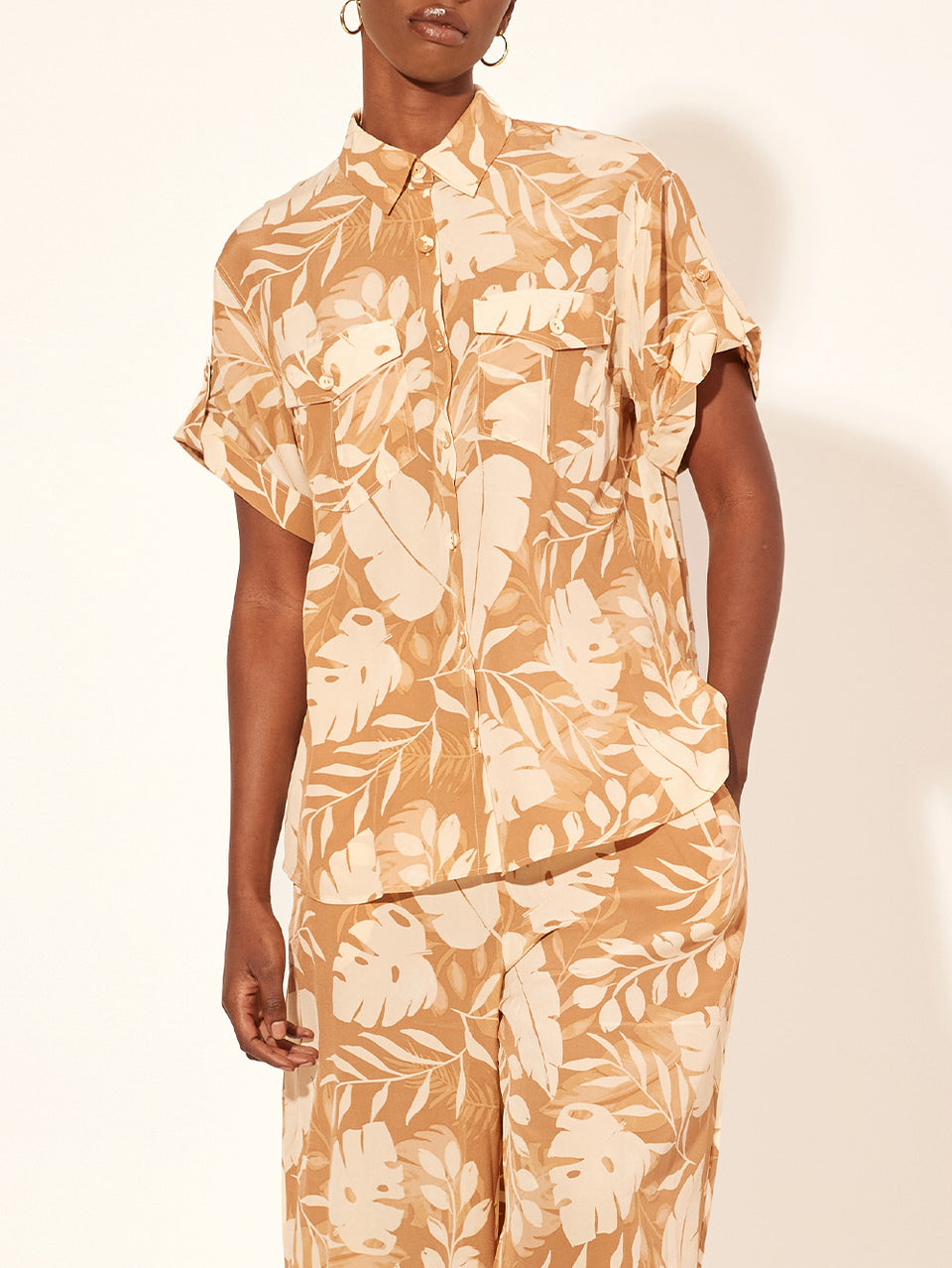 Cove Shirt KIVARI | Model wears neutral coloured leaf printed shirt close up