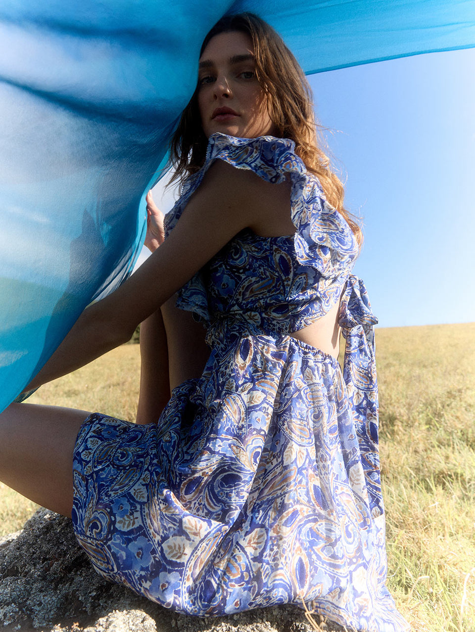 Dakota Ruffle Mini Dress KIVARI | Model wears blue paisley mini dress campaign