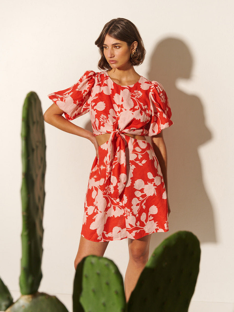 Delfina Mini Dress KIVARI | Model wears pink and red floral mini dress