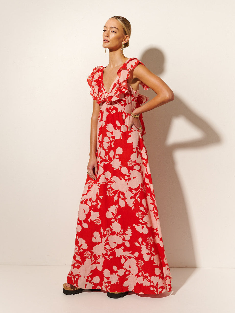 Delfina Ruffle Maxi Dress KIVARI | Model wears pink and red floral maxi dress side view