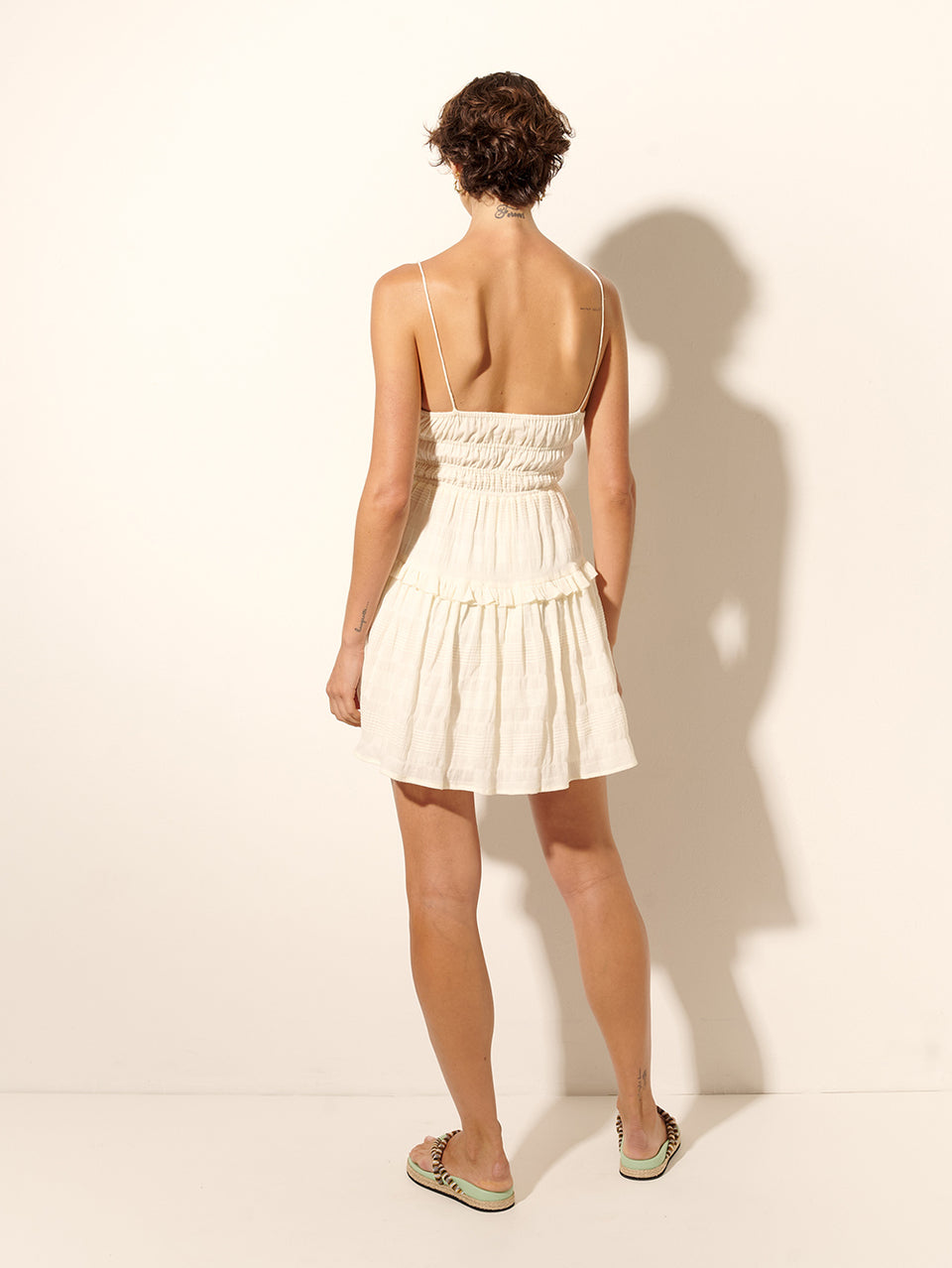 Dream Mini Dress KIVARI | Model wears cream mini dress back view