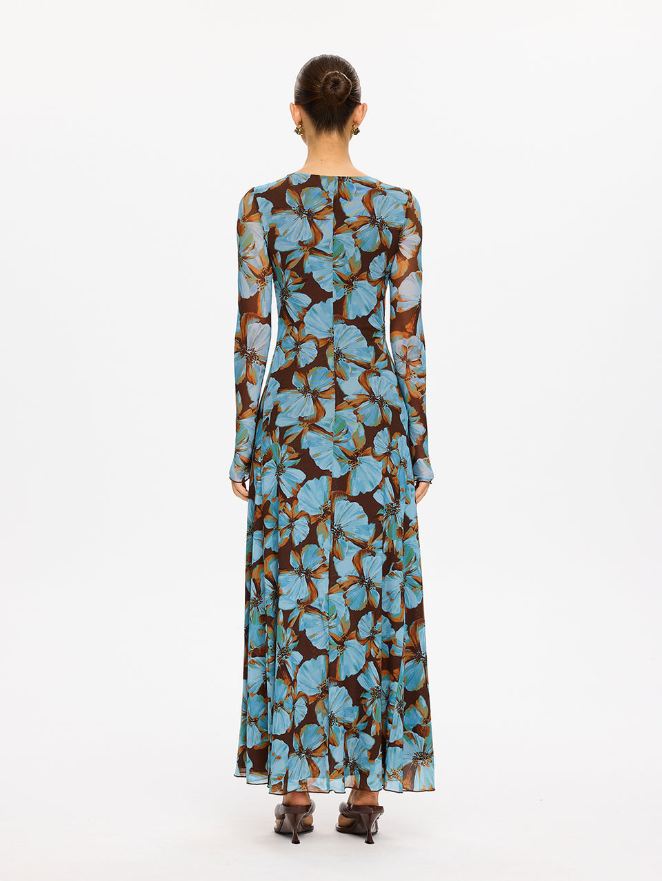 KIVARI Nieve Mesh Maxi Dress in Blue Floral Print – back view of model wearing women's long-sleeve floral mesh maxi dress