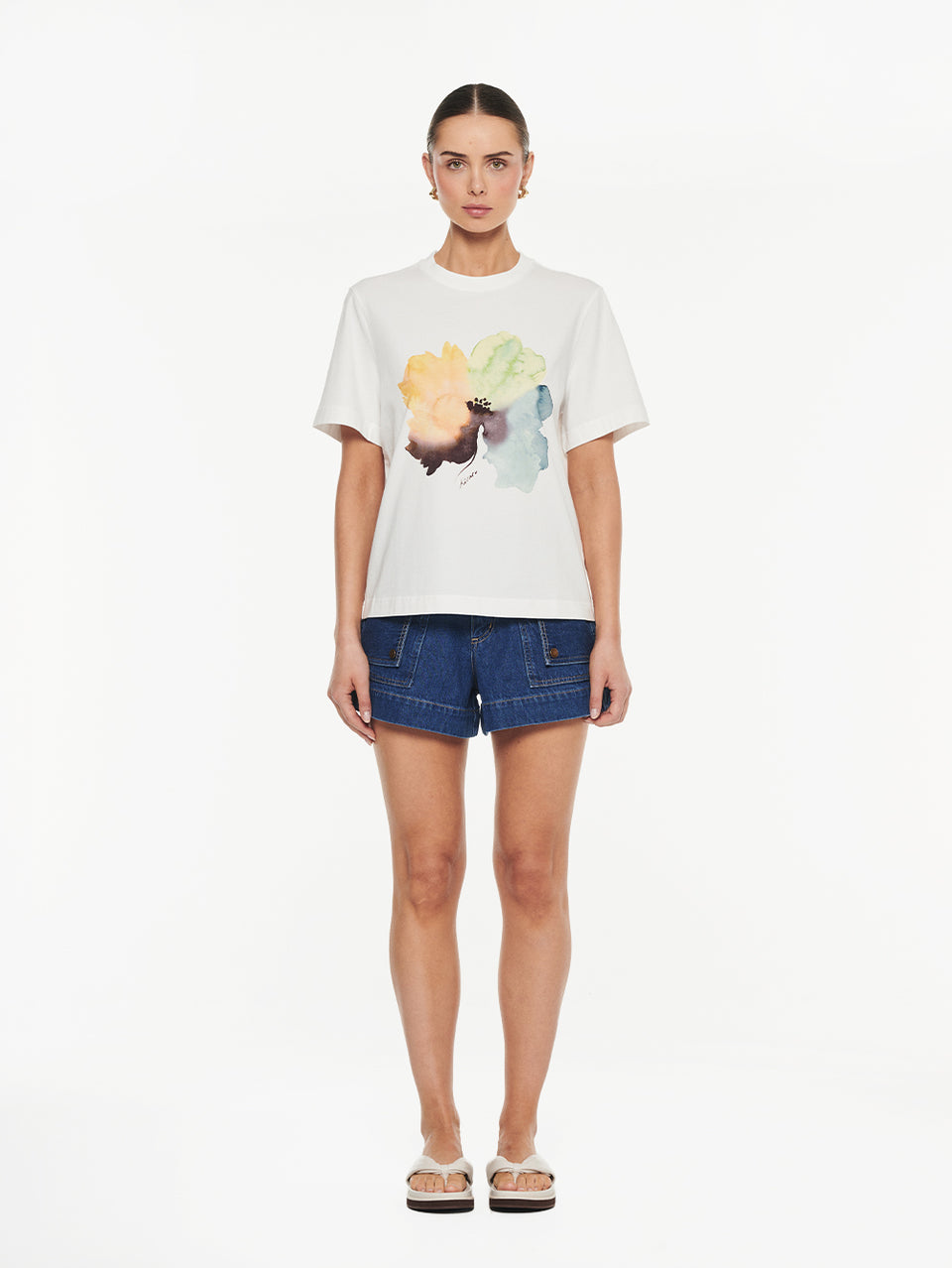 Lotte Tee in Yellow print, front view of graphic t-shirt styled with denim shorts and sandals