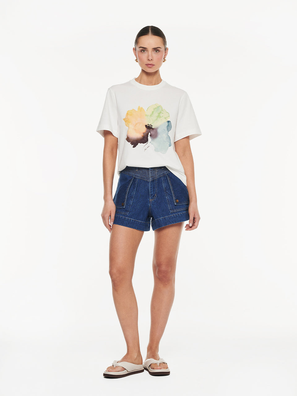Lotte Tee in Yellow print, graphic t-shirt with watercolor floral design styled with denim shorts